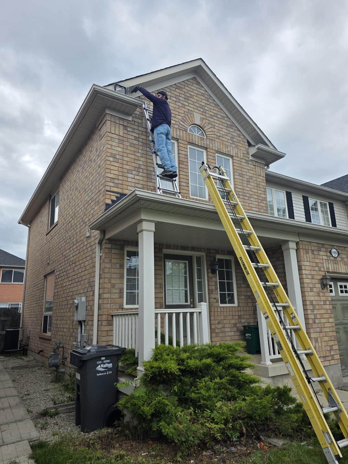 Technician inspecting a home exterior